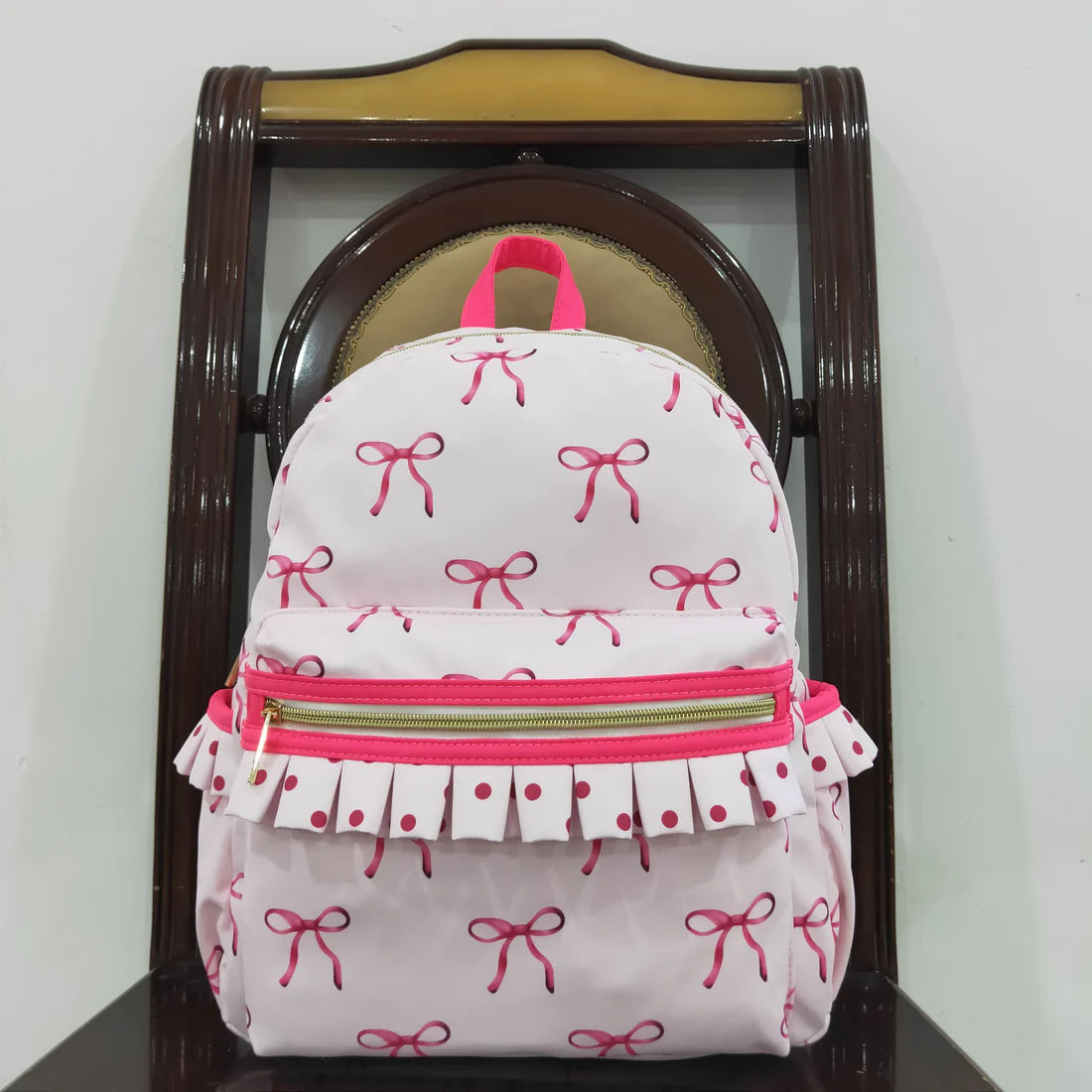 Ruffle bow backpack